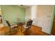 Cozy dining area with hardwood floors and a glass-top table with seating for four at 1301 Killian St, Daytona Beach, FL 32114