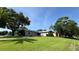 Charming single-story home with well-maintained lawn, mature trees, and a two-car garage at 1301 Killian St, Daytona Beach, FL 32114