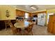 Inviting kitchen with wooden cabinets, tile floors, and functional appliances at 1301 Killian St, Daytona Beach, FL 32114