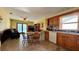 Efficient kitchen flowing into the living area, featuring wood cabinetry and a dishwasher at 1301 Killian St, Daytona Beach, FL 32114