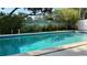 Refreshing pool perfect for relaxation surrounded by well-maintained patio and lush greenery at 1301 Killian St, Daytona Beach, FL 32114