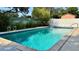 Refreshing pool perfect for relaxation surrounded by well-maintained patio and lush greenery at 1301 Killian St, Daytona Beach, FL 32114