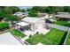 Aerial view of metal structure building with outdoor seating and well-manicured lawn at 136 W Gardenia Dr, Orange City, FL 32763