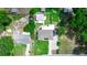 Drone view of property with well maintained lawn, house, and metal building at 136 W Gardenia Dr, Orange City, FL 32763