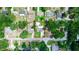 Beautiful aerial view of a property showcasing its landscaping and surrounding neighborhood at 136 W Gardenia Dr, Orange City, FL 32763