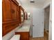 Cozy bathroom featuring a wooden vanity with a marble countertop and neutral tiling at 136 W Gardenia Dr, Orange City, FL 32763