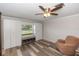 Bedroom features custom Murphy beds with a window and bench seating, plus chair at 136 W Gardenia Dr, Orange City, FL 32763