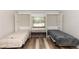 Bedroom features a Murphy bed on each side of a window with bench seating at 136 W Gardenia Dr, Orange City, FL 32763