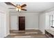 Light and bright bedroom with wood-look floors, built-in storage, and view of backyard at 136 W Gardenia Dr, Orange City, FL 32763