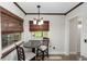 Cozy breakfast nook with a granite-topped table and natural light at 136 W Gardenia Dr, Orange City, FL 32763