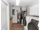 Laundry room features new cabinets, washer and dryer, and modern appliances at 136 W Gardenia Dr, Orange City, FL 32763