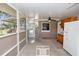 Spacious, enclosed patio with grilling area and relaxing seating at 136 W Gardenia Dr, Orange City, FL 32763