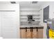 Basement storage area with white shelving and counter with modern sliding barn doors at 136 W Gardenia Dr, Orange City, FL 32763