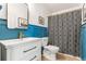 Stylishly renovated bathroom features modern fixtures, including wainscoting, and a tub with shower at 1469 Broken Oak Dr # 43A, Winter Garden, FL 34787