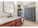 Modern bathroom with a sleek vanity, elegant mirror, and stylish shower curtain at 1469 Broken Oak Dr # 43A, Winter Garden, FL 34787