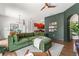 Inviting living room featuring an accent wall, wood flooring, comfortable seating, and a view into the kitchen at 1469 Broken Oak Dr # 43A, Winter Garden, FL 34787