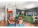 Open-concept living space with modern lighting fixtures, cozy seating, and views of the kitchen at 1469 Broken Oak Dr # 43A, Winter Garden, FL 34787
