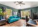 Bright and airy office boasts natural light, wood flooring, modern decor, and comfortable seating at 1469 Broken Oak Dr # 43A, Winter Garden, FL 34787