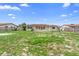 Wide view of backyard and the back of a single-story home at 1483 Meadowlark Dr, Deltona, FL 32725