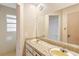 Bathroom features double sinks with granite counters and a large mirror at 1483 Meadowlark Dr, Deltona, FL 32725