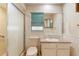 Bathroom featuring a shower with glass doors, toilet, sink, and green blinds at 1483 Meadowlark Dr, Deltona, FL 32725