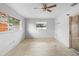 A standard bedroom with two large windows and access to a door at 1483 Meadowlark Dr, Deltona, FL 32725