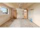 View of the bedroom with a window, ceiling fan, and doorway to the kitchen at 1483 Meadowlark Dr, Deltona, FL 32725