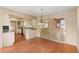 Dining room featuring wood floors, a chandelier, and a view of the kitchen at 1483 Meadowlark Dr, Deltona, FL 32725