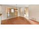 Dining room featuring wood floors, a chandelier, and a view of the exterior at 1483 Meadowlark Dr, Deltona, FL 32725
