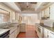 Spacious kitchen with laminate floors, abundant cabinetry, and an open layout, ideal for cooking and entertaining at 1483 Meadowlark Dr, Deltona, FL 32725