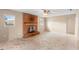 Living room view featuring brick fireplace and natural light at 1483 Meadowlark Dr, Deltona, FL 32725