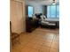 Bedroom with a queen bed, tile floors, ceiling fan and closet space at 1485 Gainsville Dr, Deltona, FL 32725
