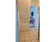 View of a hallway leading to a play area with tile flooring at 1485 Gainsville Dr, Deltona, FL 32725
