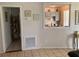 An interior view showcasing tile flooring and a glimpse into the kitchen at 1485 Gainsville Dr, Deltona, FL 32725