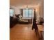 Bright bedroom featuring tile flooring, a ceiling fan, and ample natural light at 1485 Gainsville Dr, Deltona, FL 32725