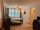 Spacious bedroom with tile flooring, ceiling fan, and natural light at 1485 Gainsville Dr, Deltona, FL 32725