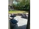 Back patio with outdoor seating, greenery, and a Jeep at 1485 Gainsville Dr, Deltona, FL 32725