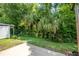 Backyard featuring partial fence and view of greenery at 15 Misners Trl, Ormond Beach, FL 32174