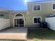 View of the backyard featuring a patio, sliding glass door, and a fenced perimeter at 15 Misners Trl, Ormond Beach, FL 32174