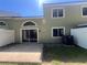 View of the backyard featuring a patio, sliding glass door, and a fenced perimeter at 15 Misners Trl, Ormond Beach, FL 32174