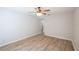 A bright bedroom with light-colored wood-look tile and a ceiling fan at 15 Misners Trl, Ormond Beach, FL 32174