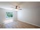 Bedroom with hardwood-look floors, a ceiling fan, and natural light at 15 Misners Trl, Ormond Beach, FL 32174