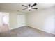 Bedroom featuring a ceiling fan, carpet, and a closet at 15 Misners Trl, Ormond Beach, FL 32174
