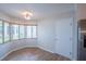 Cozy dining area with wood-look tile floors, and abundant natural light at 15 Misners Trl, Ormond Beach, FL 32174