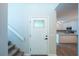 Front entryway with a view to the kitchen and a stairway at 15 Misners Trl, Ormond Beach, FL 32174