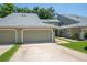 Attractive condo featuring a two-car garage, well-kept lawn, and mature trees in a great location at 15 Misners Trl, Ormond Beach, FL 32174