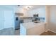 Beautiful renovated kitchen equipped with stainless steel appliances, and bright white cabinets at 15 Misners Trl, Ormond Beach, FL 32174