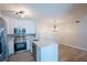 Modern kitchen featuring stainless steel appliances, quartz countertops, and white cabinets at 15 Misners Trl, Ormond Beach, FL 32174