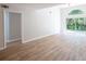 Bright living area with wood floors and access to a patio at 15 Misners Trl, Ormond Beach, FL 32174