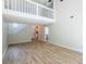 Spacious living room showcasing wood floors, loft area, and natural light at 15 Misners Trl, Ormond Beach, FL 32174